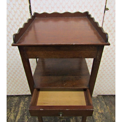 2617 - A small Georgian mahogany square cut wash stand with three quarter gallery and central drawer on squ... 