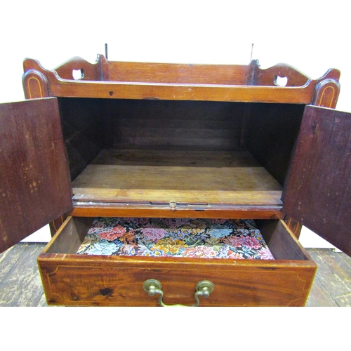 2618 - A Georgian mahogany tray top commode, the front elevation enclosed by a pair of panelled doors and f... 