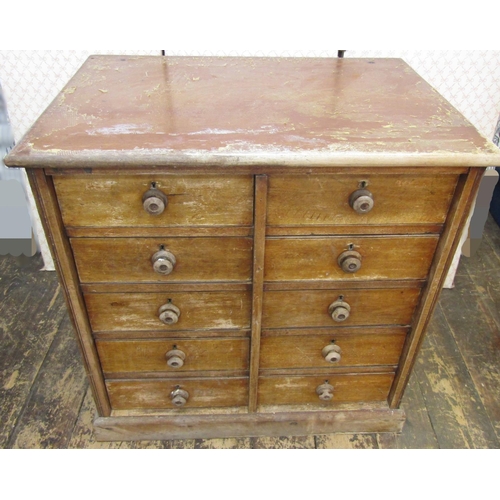 2629 - 19th century oak filing cabinet enclosing ten drawers in a side by side arrangement, set on a plinth... 