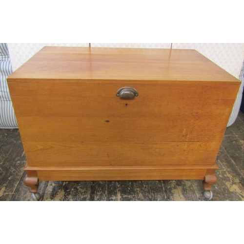 2633 - A teakwood blanket chest of simple construction, raised on shallow supports, 95cm wide