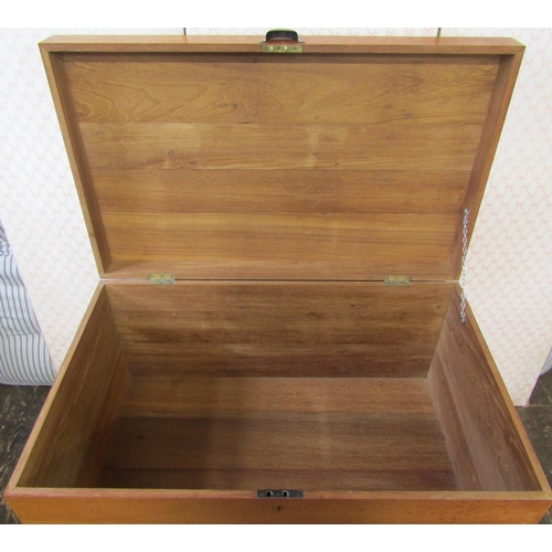 2633 - A teakwood blanket chest of simple construction, raised on shallow supports, 95cm wide