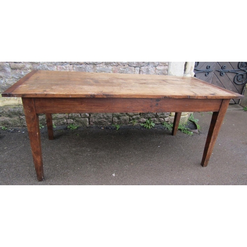 2637 - An old oak farmhouse table, the plank top with cleated ends, raised on four square tapered legs encl... 