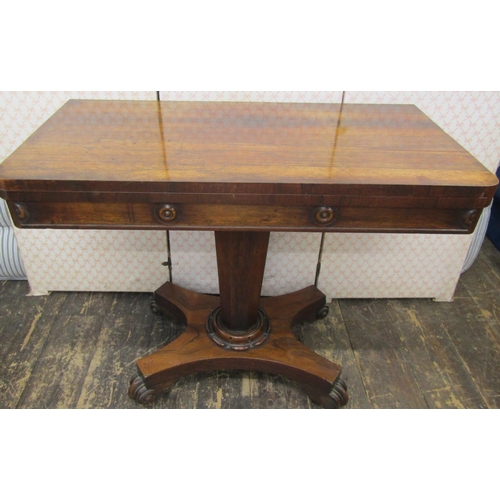 2641 - A late Regency rosewood foldover top card table on inverted octagonal tapering column and platform b... 