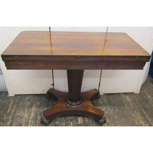 2641 - A late Regency rosewood foldover top card table on inverted octagonal tapering column and platform b... 