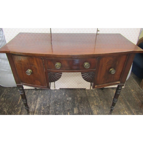 2642 - A small Regency mahogany bowfronted sideboard, enclosed by three drawers to a central kneehole, with... 