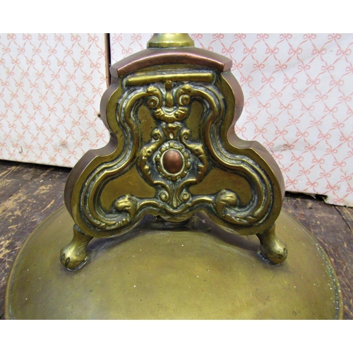 2643 - A late 19th century brass and overlaid copper jardinière and stand, the upper section with lion mask... 