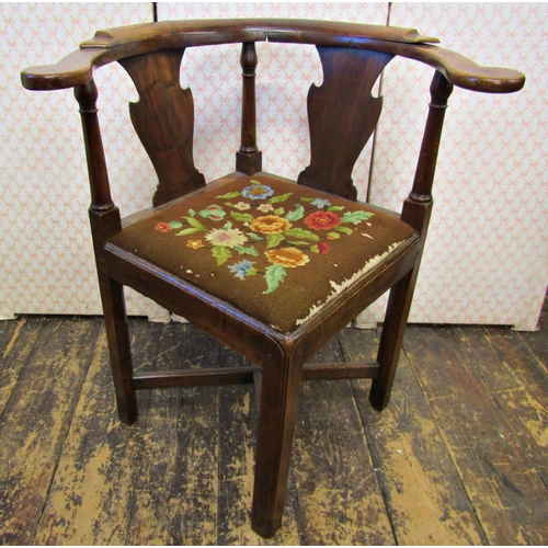 2651 - A Georgian country made corner chair, principally in walnut, with upholstered tapestry seat