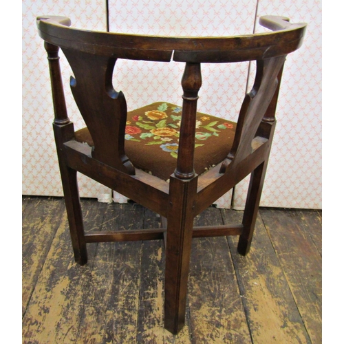 2651 - A Georgian country made corner chair, principally in walnut, with upholstered tapestry seat