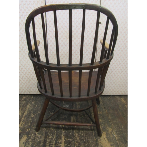 2654 - An 18th century Windsor hoop back elbow chair, principally in ash, the simple stick supports united ... 