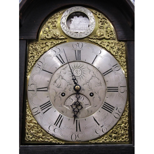 2662 - An early 19th century oak longcase clock, the casework with later geometric carved detail, enclosing... 