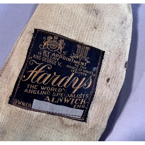 1514 - A vintage Hardy’s two piece split cane fishing rod, complete with original Hardy’s cloth bag.