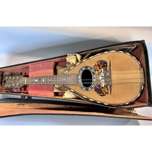 1521 - A Pietro Ruffini of Brescia mandolin and case both in need of repair.