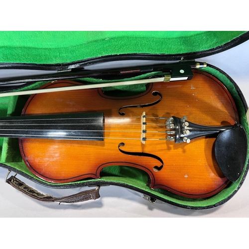 1522 - A Parrot Violin, made in China, and bow with a hard carry case, 55cm max and 35cm back.