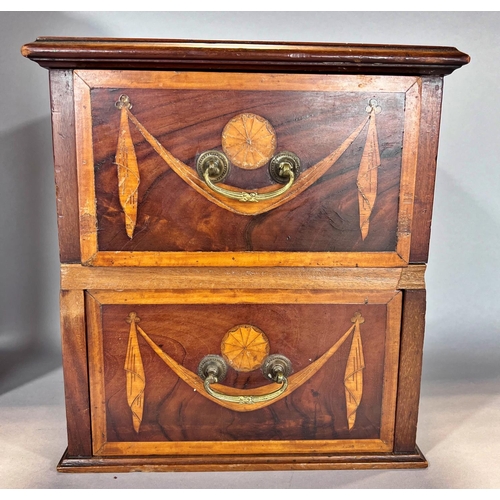 1526 - A small cabinet with poke work flowers on a basket weave affect background and a pair of drawers fro... 