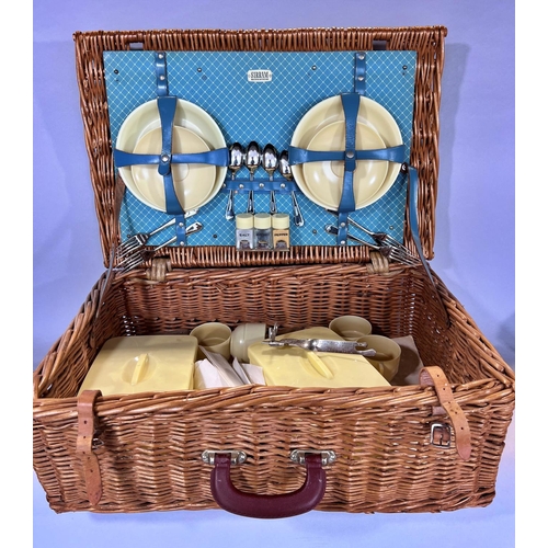 1527 - A 1950’s Sirram picnic basket with yellow plastic plates, sandwich boxes, cups, condiments etc (not ... 