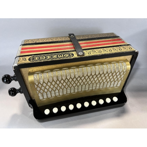 1549 - A red Hohner accordion made in Germany, in working order, and a red concertina Made in  Germany, in ... 