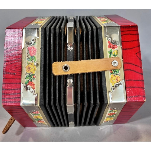 1549 - A red Hohner accordion made in Germany, in working order, and a red concertina Made in  Germany, in ... 