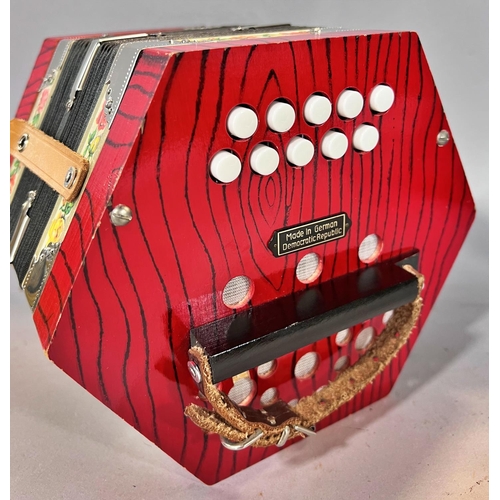 1549 - A red Hohner accordion made in Germany, in working order, and a red concertina Made in  Germany, in ... 