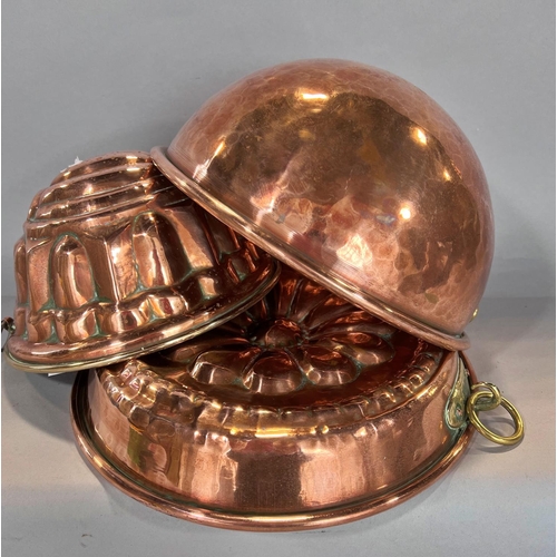 1550 - Two 19th century copper jelly and aspic moulds, a copper mixing bowl and a copper double handled pan... 