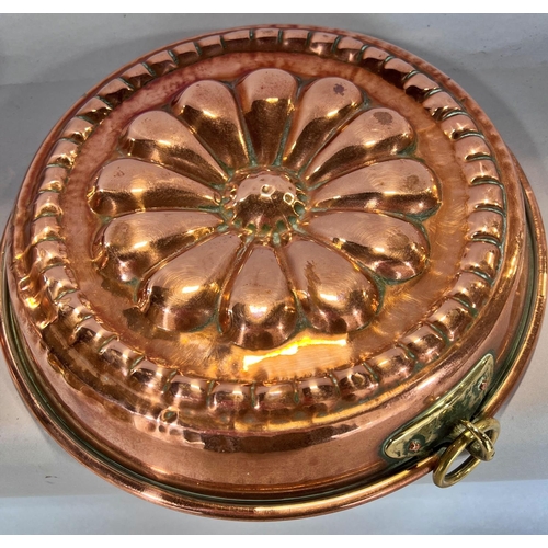 1550 - Two 19th century copper jelly and aspic moulds, a copper mixing bowl and a copper double handled pan... 