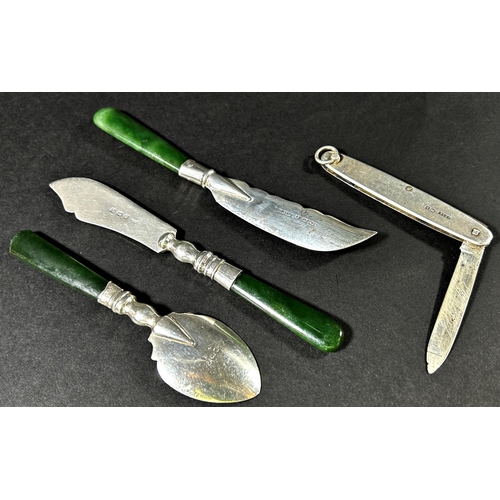 1245 - A small early 20th century collection of silver cutlery consisting of Birmingham fish knives and jam... 