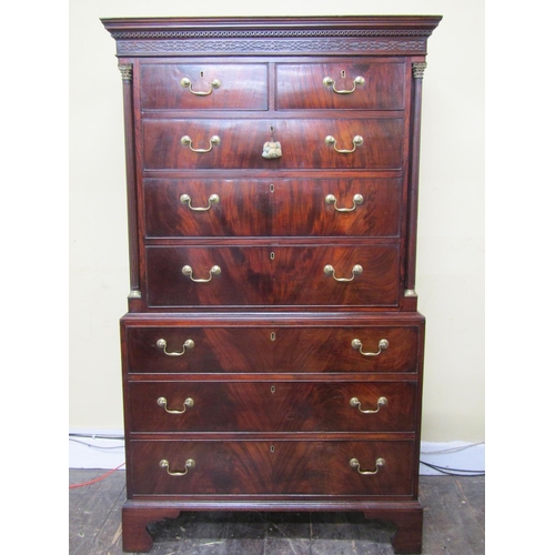 2645 - A Georgian mahogany chest on chest fitted with six long and two short graduated drawers, the upper s... 