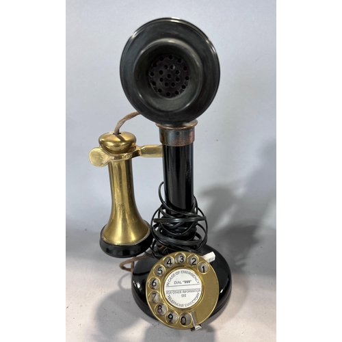 1542 - An early 20th century GPO candlestick telephone with brass receiver and dial, incorporating a light ... 