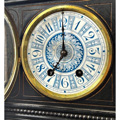 1363 - A Victorian mantle clock in the aesthetic style, the ebonised case with geometric detail and gilt hi... 