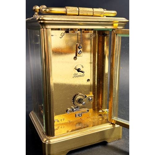 1366 - Victorian brass cased carriage clock, with enamelled dial and eight day time piece