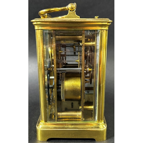 1367 - A late 19th century French carriage clock with enamelled dial and eight day striking movement, with ... 