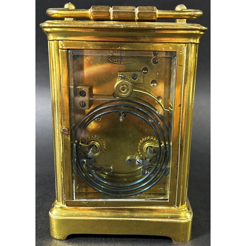 1367 - A late 19th century French carriage clock with enamelled dial and eight day striking movement, with ... 