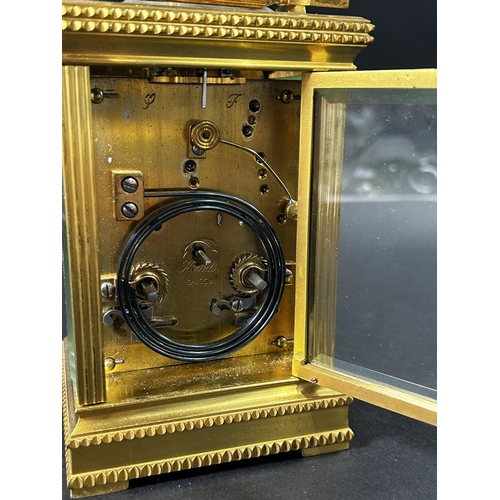 1368 - 19th century French carriage clock, the brass case with reeded columns, set within dog tooth borders... 