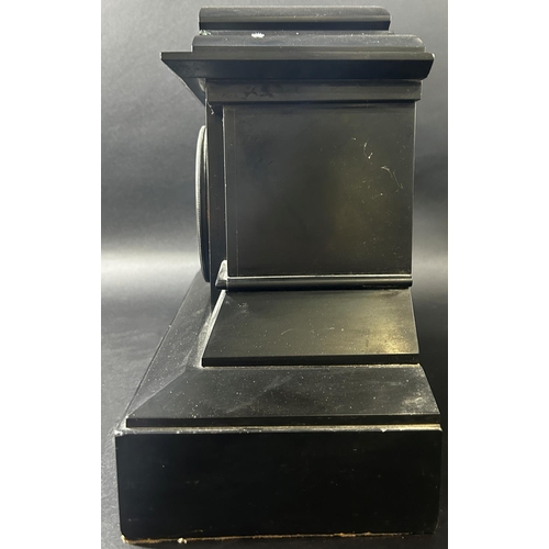 1371 - A Victorian black slate and marble mantle clock of architectural form enclosing an eight day strikin... 