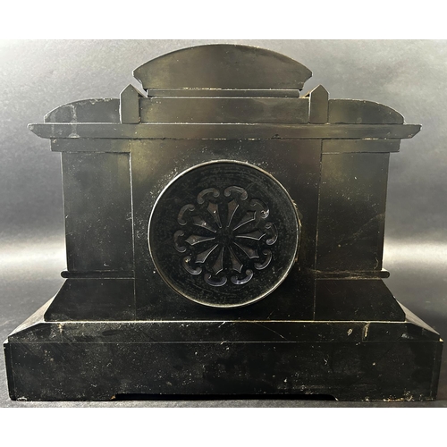 1371 - A Victorian black slate and marble mantle clock of architectural form enclosing an eight day strikin... 