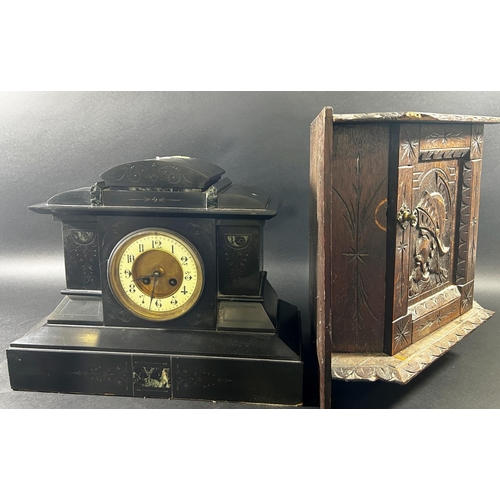 1371 - A Victorian black slate and marble mantle clock of architectural form enclosing an eight day strikin... 