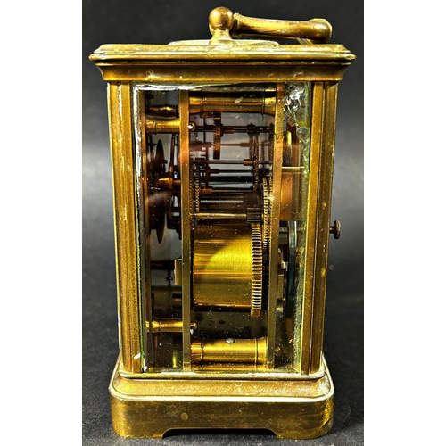 1372 - A brass carriage clock with eight day striking movement together with a further mantle clock in the ... 