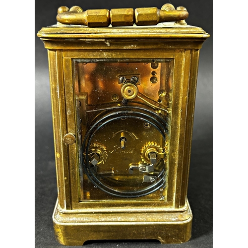 1372 - A brass carriage clock with eight day striking movement together with a further mantle clock in the ... 