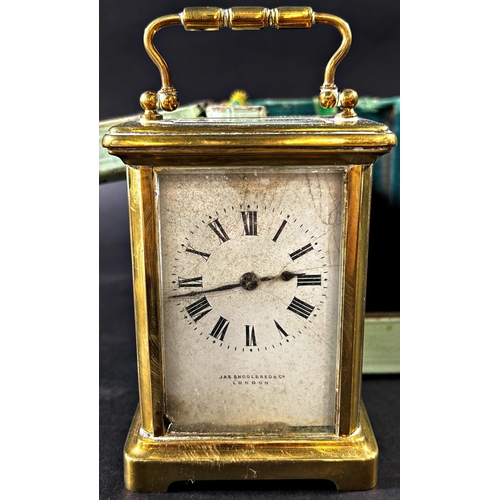 1376 - A brass carriage clock with square enamelled dial retailed by Mappin & Webb, together with a further... 