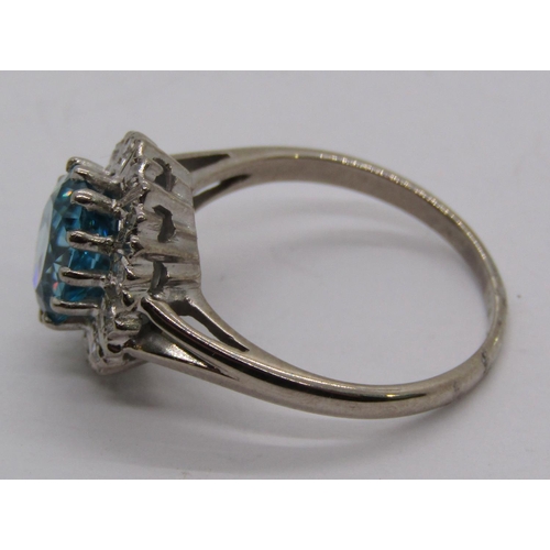 1310 - 18ct white gold blue zircon and diamond oval cluster ring, size M, 4.3g