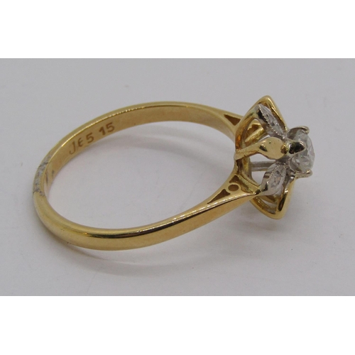 1311 - 18ct flower head diamond ring, centre stone 0.20ct approx, size L/M, 2.3g