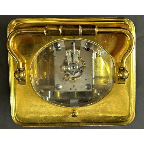 1367 - A late 19th century French carriage clock with enamelled dial and eight day striking movement, with ... 