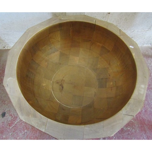 2416A - An unusual hardwood centre table in the form of a hollowed bowl, with plate glass top, 92cm diameter... 