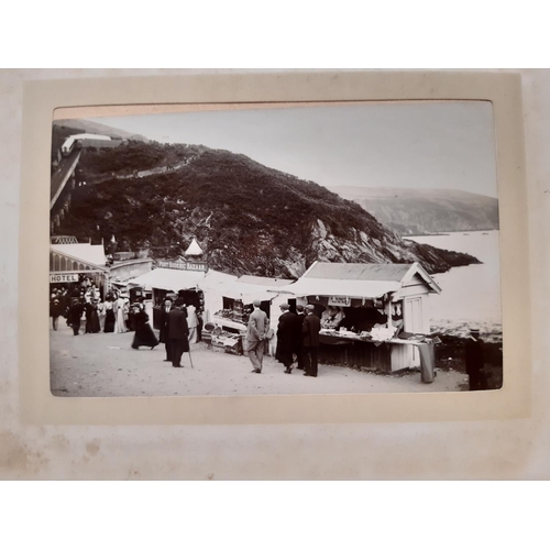 319 - Three albums containing a collection of late 19th century photographs with scenic views of the Briti... 