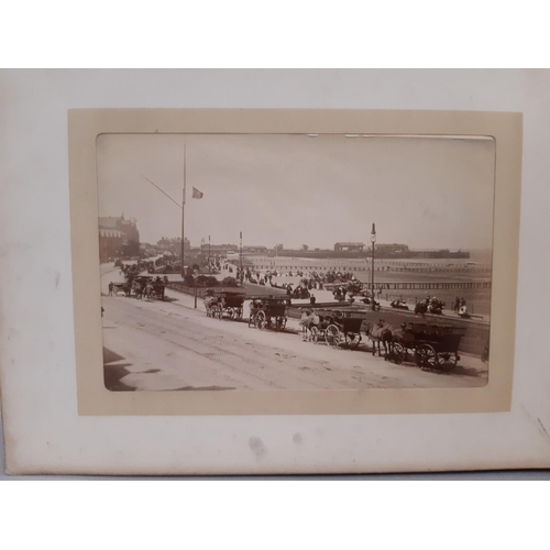 319 - Three albums containing a collection of late 19th century photographs with scenic views of the Briti... 