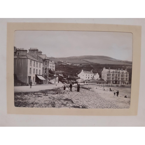 319 - Three albums containing a collection of late 19th century photographs with scenic views of the Briti... 