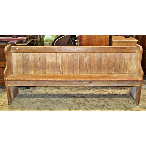 2288 - A Victorian pitch pine church pew, with chamfered ends, plank seat and tongue and groove boarded bac... 