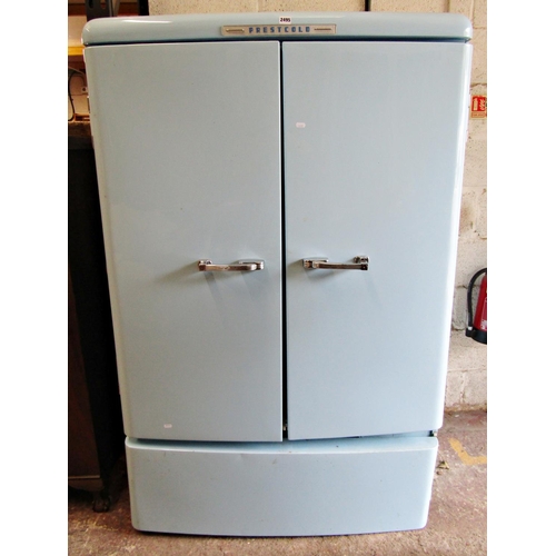 2493 - A Prestcold vintage two divisional refrigerator in a pale blue colourway enclosed by two doors with ... 