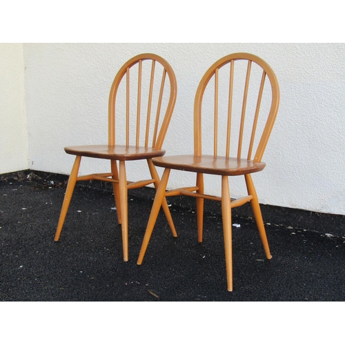 2498 - A pair of Ercol hoop back dining chairs with elm seats