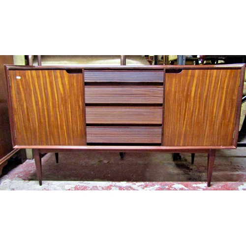 2502 - A good quality Richard Hornby Fyne Layde sideboard the central tower of four graduated and reeded dr... 