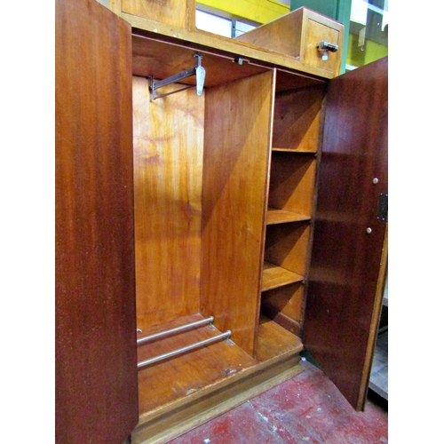 2524 - An Art Deco wall cabinet enclosed by a pair of doors and two drawers with central drop well, 77 cm w... 